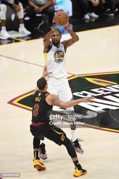 Kevin Durant of the Golden State Warriors shoots against George Hill of the Cleveland Cavaliers during Game Three of the 2018 NBA Finals at Quicken...