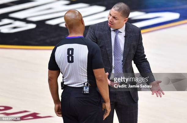 Head coach Tyronn Lue of the Cleveland Cavaliers talks with referee Marc Davis during Game Three of the 2018 NBA Finals against the Golden State...