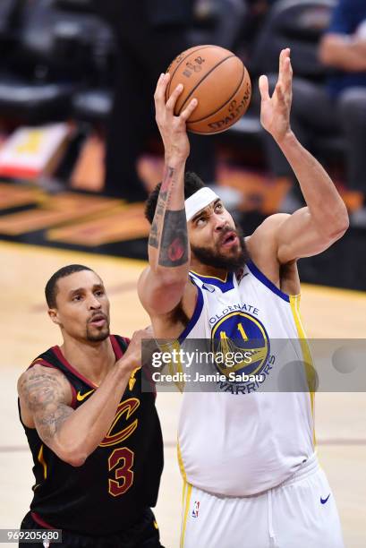 JaVale McGee of the Golden State Warriors goes up against George Hill of the Cleveland Cavaliers during Game Three of the 2018 NBA Finals at Quicken...
