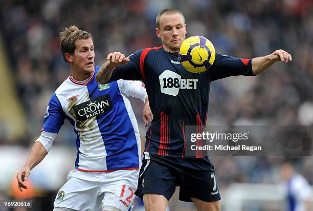 Matt Taylor of Bolton holds off Morton Gamst Pedersen of Blackburn during the Barclays Premier League match between Blackburn Rovers and Bolton...