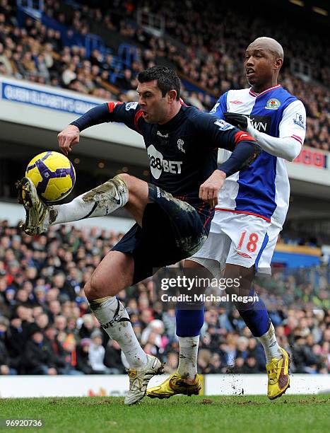 Paul Robinson of Bolton holds off El Hadji Diouf of Blackburn during the Barclays Premier League match between Blackburn Rovers and Bolton Wanderers...