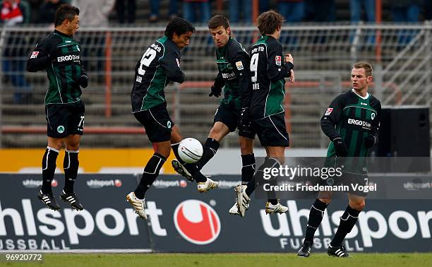 Stephan Schroeck, Sami Allagui, Marco Caliguiri, Christopher Noethe and Bernd Nehrig of Fuerth jump after forming a wall during the Second Bundesliga...