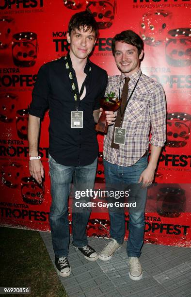 Abe Forsythe, winner of 1st prize for "Shock", poses with actor Elijah Wood during the Tropfest 2010 short film festival at The Domain on February...