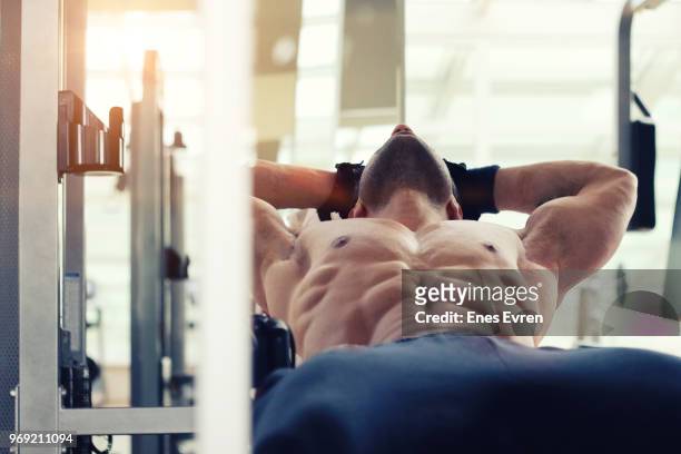 fitness instructor posing in health club with dumbbell - protein shaker stock pictures, royalty-free photos & images