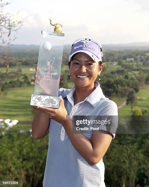 Ai Miyazato of Japan poses with the trophy after winning the final round of the Honda PTT LPGA Thailand at Siam Country Club on February 21, 2010 in...