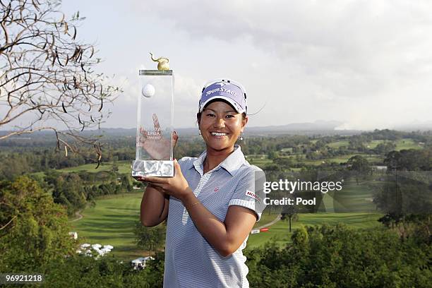 Ai Miyazato of Japan poses with the trophy after winning the final round of the Honda PTT LPGA Thailand at Siam Country Club on February 21, 2010 in...