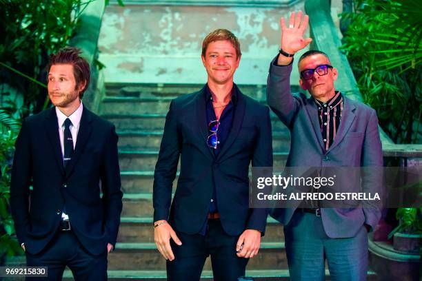 Rock band Interpol members lead guitar player and backing vocals Daniel Kessler, lead singer and bass guitar player, Paul Banks and drummer Sam...