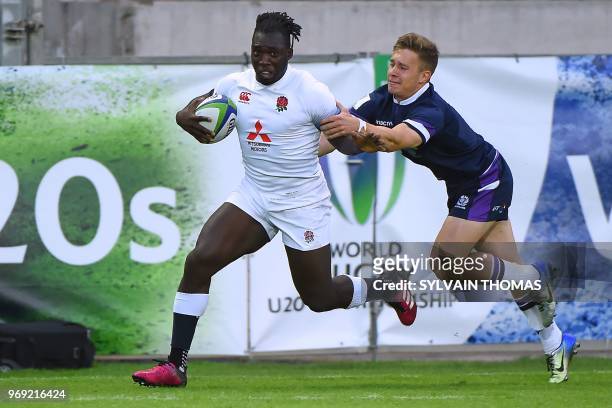 England's Gabriel Ibitoye runs with the ball during the Rugby Union World Cup U20 championship match England vs Scotland at the Mediterranean Stadium...