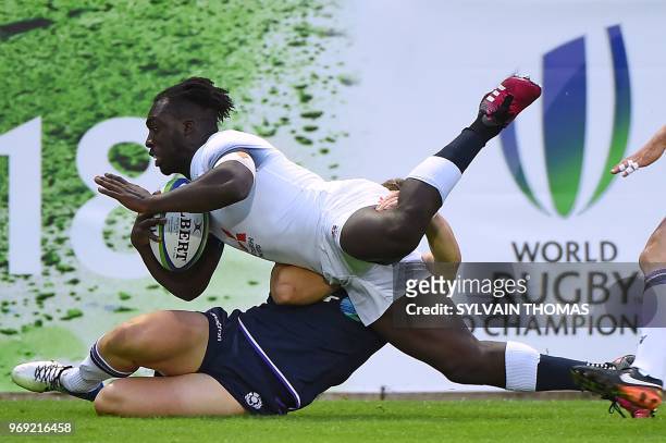 England's Gabriel Ibitoye dives and scores a try during the Rugby Union World Cup U20 championship match England vs Scotland at the Mediterranean...