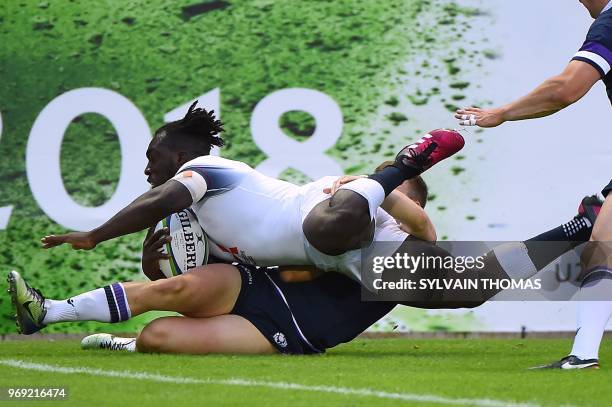 England's Gabriel Ibitoye dives and scores a try during the Rugby Union World Cup U20 championship match England vs Scotland at the Mediterranean...