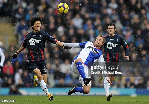 Chung-Yong Lee of Bolton takes on Vince Grella of Blackburn during the Barclays Premier League match between Blackburn Rovers and Bolton Wanderers at...