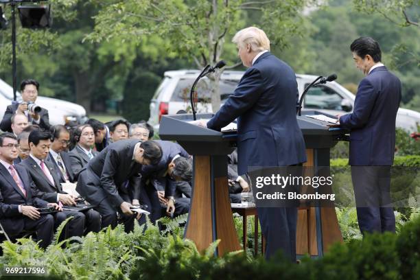 President Donald Trump, left, and Shinzo Abe, Japan's prime minister, hold a joint news conference in the Rose Garden of the White House in...