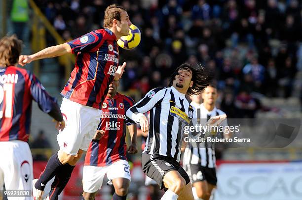 Carvalho De Oliveira Amauri of Juventus FC competes with Vangelis Moras of Bologna FC during the Serie A match between Bologna FC and Juventus FC at...