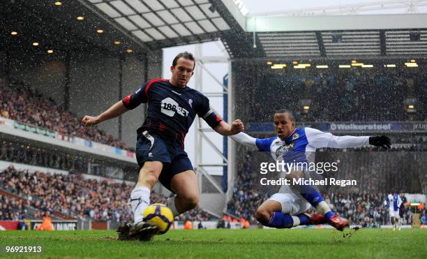 Martin Olsson of Blackburn challenges Kevin Davies of Bolton during the Barclays Premier League match between Blackburn Rovers and Bolton Wanderers...