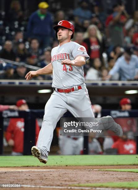 Scott Schebler of the Cincinnati Reds runs during a baseball game against the San Diego Padres at PETCO Park on June 1, 2018 in San Diego, California.