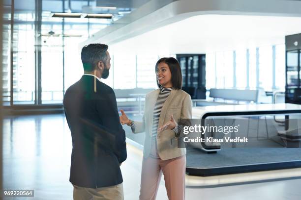 stylish co-workers having discussion in office building - star style lounge imagens e fotografias de stock