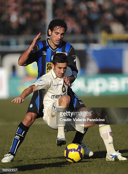 Nicola Amoruso of Atalanta BC competes for the ball with Giampiero Pinzi of AC Chievo Verona during the Serie A match between Atalanta BC and AC...