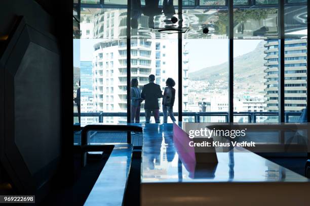 stylish co-workers having discussion in office building - cape town buildings stock pictures, royalty-free photos & images