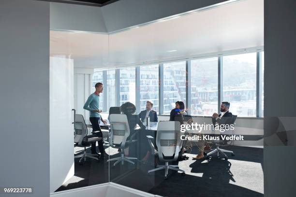 young entrepreneur presenting project in exclusive boardroom - boy in briefs stock pictures, royalty-free photos & images