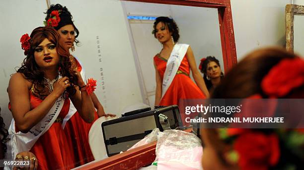 Indian models are reflected in the mirror as they prepare for the finals of the 'Indian Super Queen' beauty pagaent for the transgender community in...