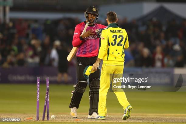 Last batsman Abi Sakande of Sussex shakes hands with Glenn Maxwell of Australia during the one day tour match between Sussex and Australia at The 1st...