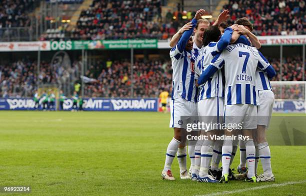 Cicero of Berlin is celebrated by his team mates after scoring his team's third goal during the Bundesliga match between SC Freiburg and Hertha...
