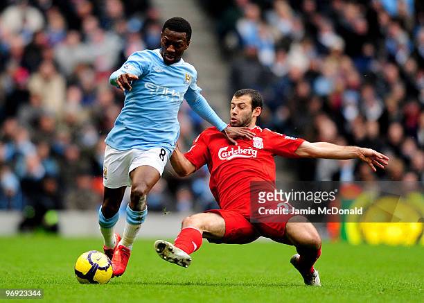 Shaun Wright-Phillips battles with Javier Mascherano of Liverpool during the Barclays Premier League match between Manchester City and Liverpool at...