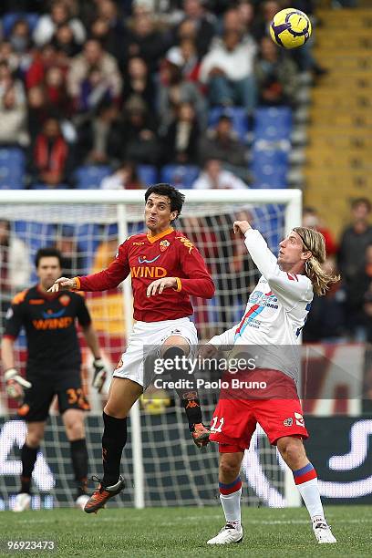 Maxi Lopez of Catania Calcio and Nicolas Burdisso of AS Roma in action during the Serie A match between AS Roma and Catania Calcio at Stadio Olimpico...