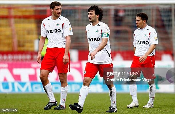Ronny Koenig, Markus Kaya and Mike Terranova of Oberhausen leave dejected of the pitch after the Second Bundesliga match between RW Oberhausen and...