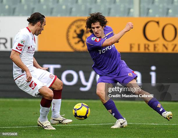 Stevan Jovetic of ACF Fiorentina competes for the ball against davida Marchini of AS Livorno during the Serie A match between ACF Fiorentina and AS...