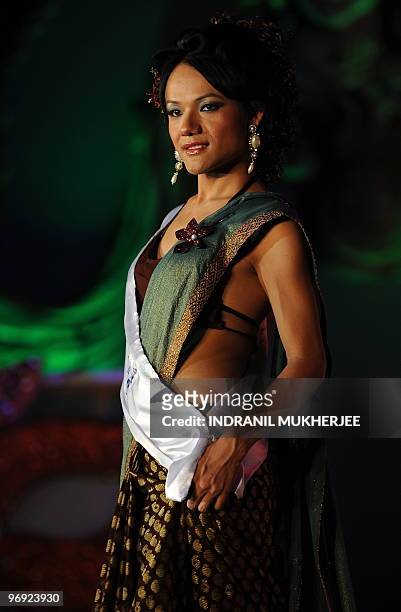 An Indian transgender walks the ramp during the finals of the 'Indian Super Queen' beauty pagaent for the transgender community in Mumbai on February...