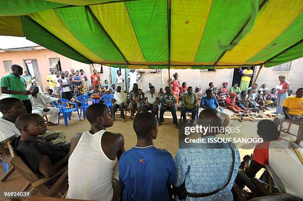 Ivorians mourn a male relative aged 15 shot during demonstrations in the western town of Gagnoa on February 20, 2010. New opposition protests against...