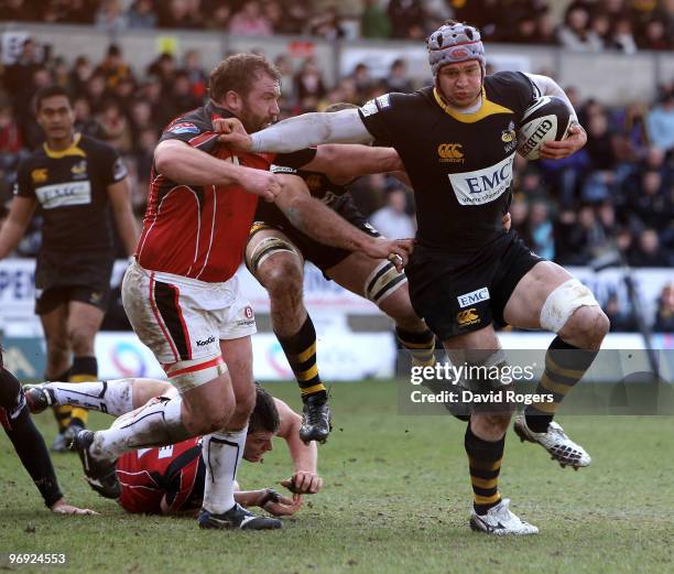 Dan Ward-Smith of Wasps holds off Richard Skuse during the Guinness Premiership match between London Wasps and Saracens at Adams Park on February 21,...