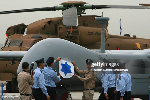 The Israeli Air Force insignia is fixed to the Eitan, the IAF's latest generation of Unmanned Aerial Vehicle , during a ceremony intoducing it into...