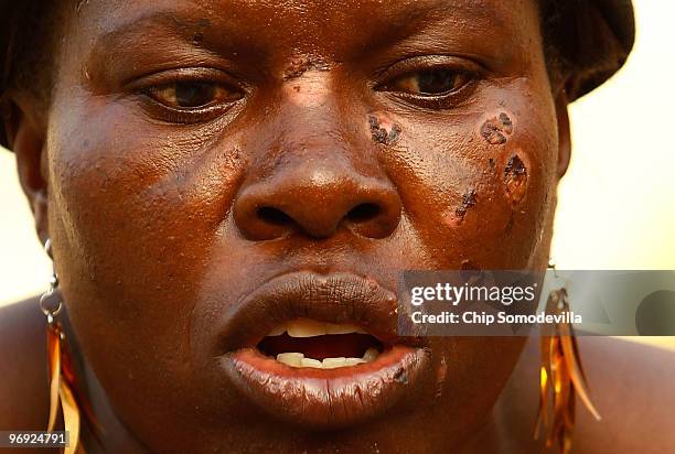 Ginette Ju-Louis works to measure and mark-off where she will erect her new shack in the collapsed Marche Tete Boeuf market along the Grande Rue...