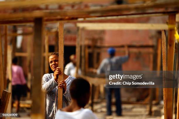 Hatians begin to build shacks on a concrete slab where the collapsed Marche Tete Boeuf market once stood along the Grand Rue, one of the oldest...