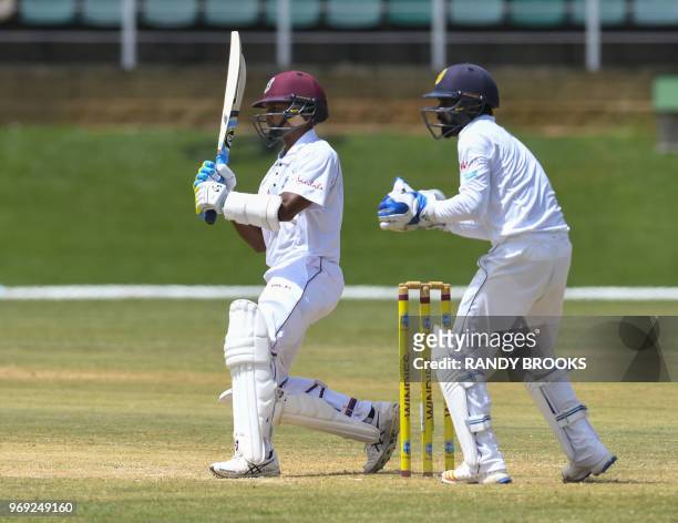 Shane Dowrich of West Indies hits 4 during day 2 of the 1st Test between West Indies and Sri Lanka at Queen's Park Oval, Port of Spain, Trinidad, on...