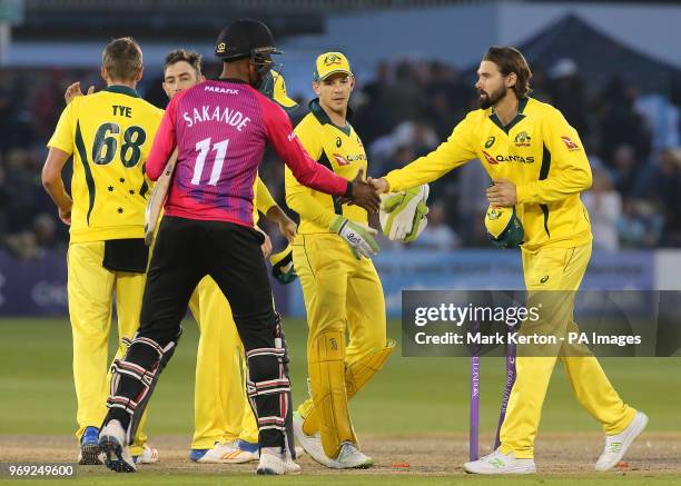 Sussex player Abidine Sakande shakes hands with Australia's Kane Richardson at the end of the match after Australia win during the tour match at the...