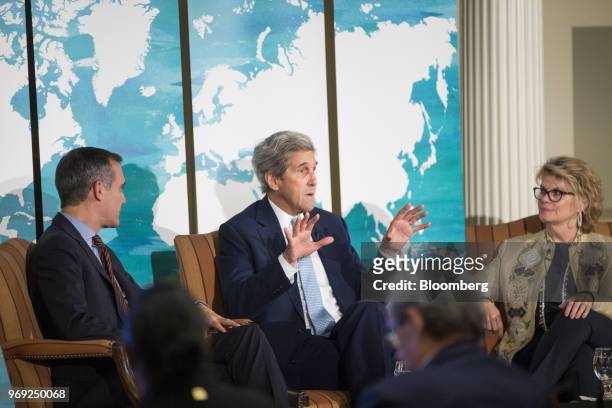 John Kerry, former U.S. Secretary of State, center, speaks while Eric Garcetti, mayor of Los Angeles, left, and Anne Finucane, co-vice chairman of...