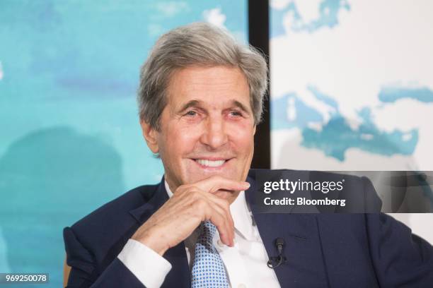 John Kerry, former U.S. Secretary of State, smiles during the International Mayors Climate Summit in Boston, Massachusetts, U.S., on Thursday, June...