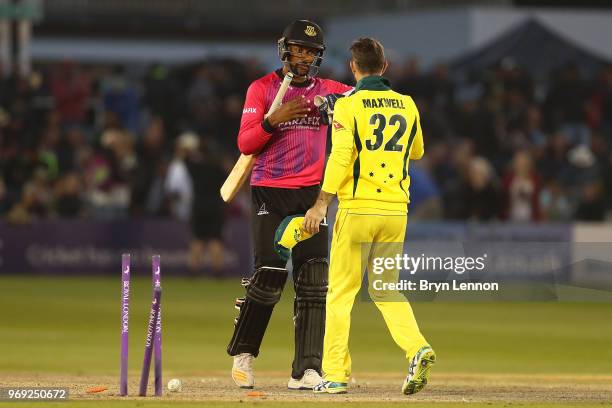 Last batsman Abi Sakande of Sussex shakes hands with Glenn Maxwell of Australia during the one day tour match between Sussex and Australia at The 1st...