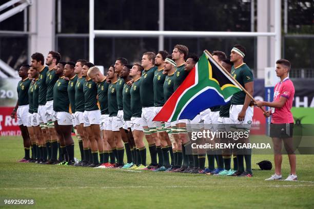 South Africa's players listen to their national anthem ahead of the U20 World Rugby union Championship match between France and South Africa at the...