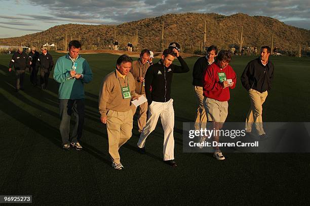 Camilo Villegas of Colombia speak to reporters after completing the continuation of the semi final round of Accenture Match Play Championships at the...