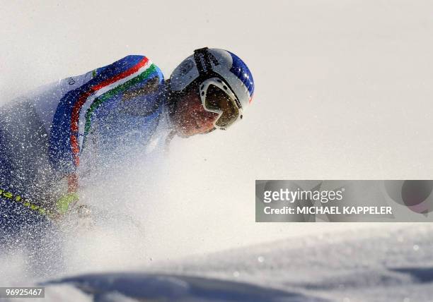 Italy's Manfred Moelgg reacts in the finish area during the men's super-combined downhill race of the Vancouver 2010 Winter Olympics at the Whistler...