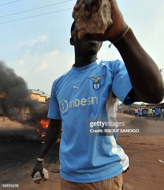 An ivorian opposition group member protests on February 20, 2010 the western town of Gagnoa against Ivorian President Laurent Gbagbo following deadly...