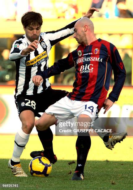 Juventus Brazilian midfielder Diego fights for the ball with Bologna's midfielder Roberto Guana during their Serie A football match Bologna vs...