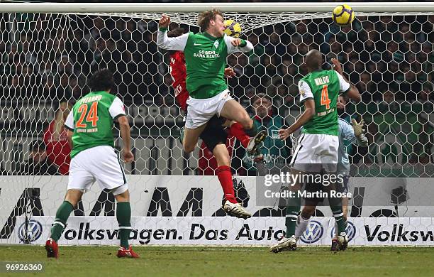 Per Mertesacker of Bremen scores his team's 2nd goal during the Bundesliga match between Werder Bremen and Bayer Leverkusen at the Weser Stadium on...