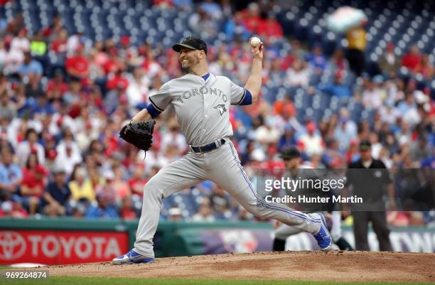 Starting pitcher J.A. Happ of the Toronto Blue Jays throws a pitch during a game against the Philadelphia Phillies at Citizens Bank Park on May 27,...