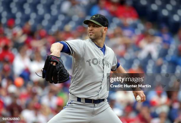 Starting pitcher J.A. Happ of the Toronto Blue Jays throws a pitch during a game against the Philadelphia Phillies at Citizens Bank Park on May 27,...