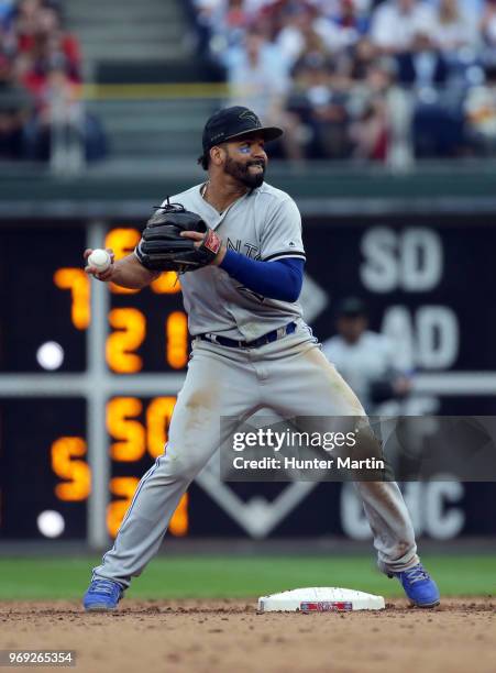 Devon Travis of the Toronto Blue Jays throws the ball during a game against the Philadelphia Phillies at Citizens Bank Park on May 27, 2018 in...